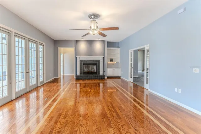 wooden floor in an empty room with a window