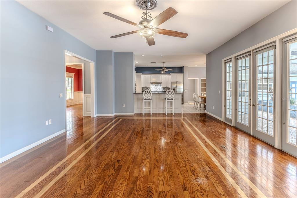 7512 Oak Tree Lane Spring Hill, FL 34607 - Photo 29 of 89 a view of a living room with a large window with wooden floor