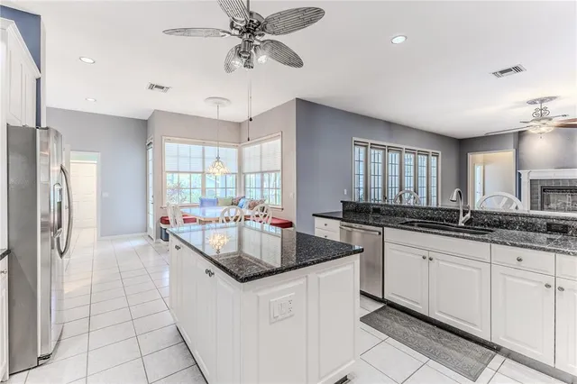 a bathroom with a sink a large mirror and a shower