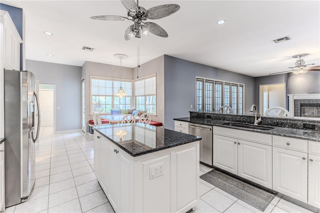 7512 Oak Tree Lane Spring Hill, FL 34607 - Photo 38 of 89 a kitchen with granite countertop a sink a counter top space appliances and cabinets