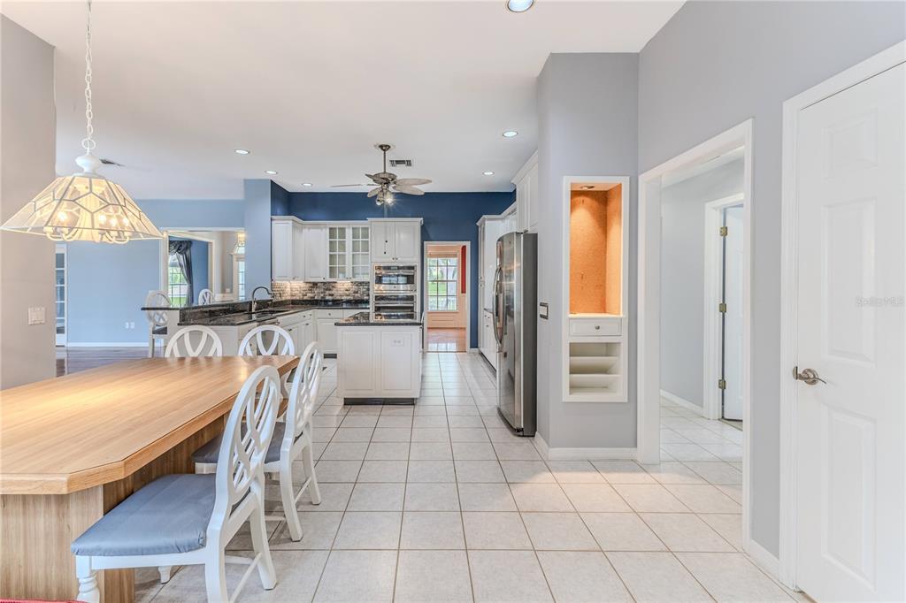 7512 Oak Tree Lane Spring Hill, FL 34607 - Photo 43 of 89 a kitchen with stainless steel appliances granite countertop a refrigerator and a sink