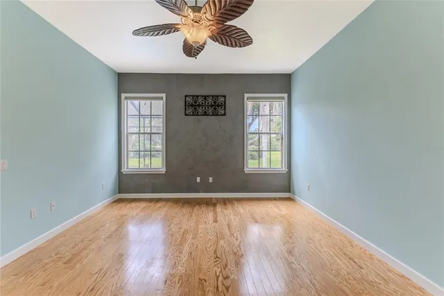 an aerial view of residential houses with outdoor space and street view