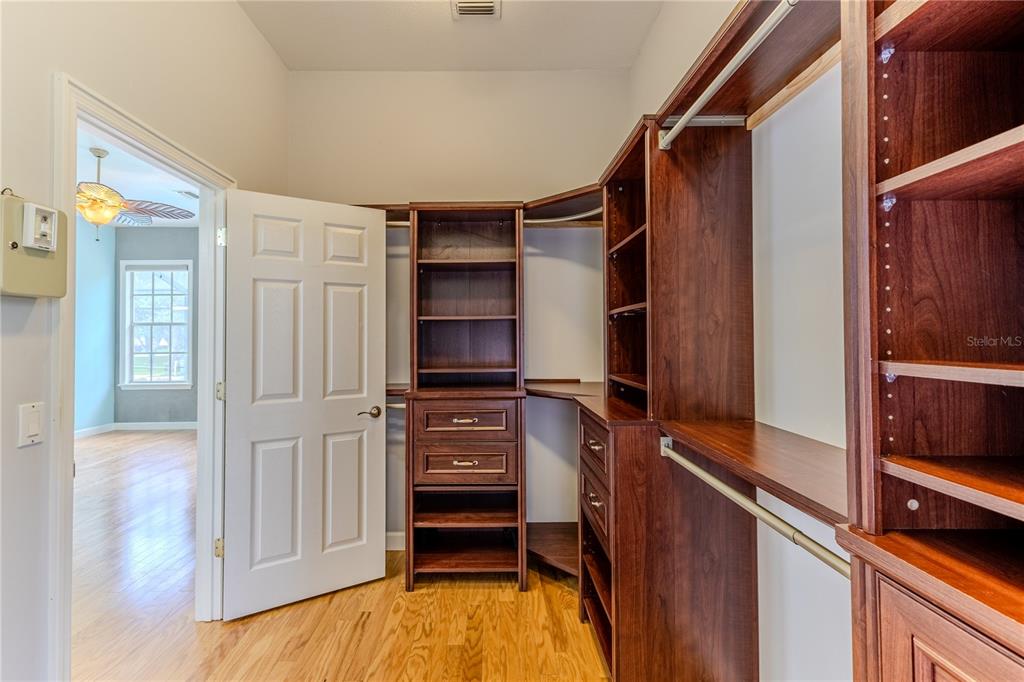 7512 Oak Tree Lane Spring Hill, FL 34607 - Photo 53 of 89 a view of walk in closet with clothes and shoes