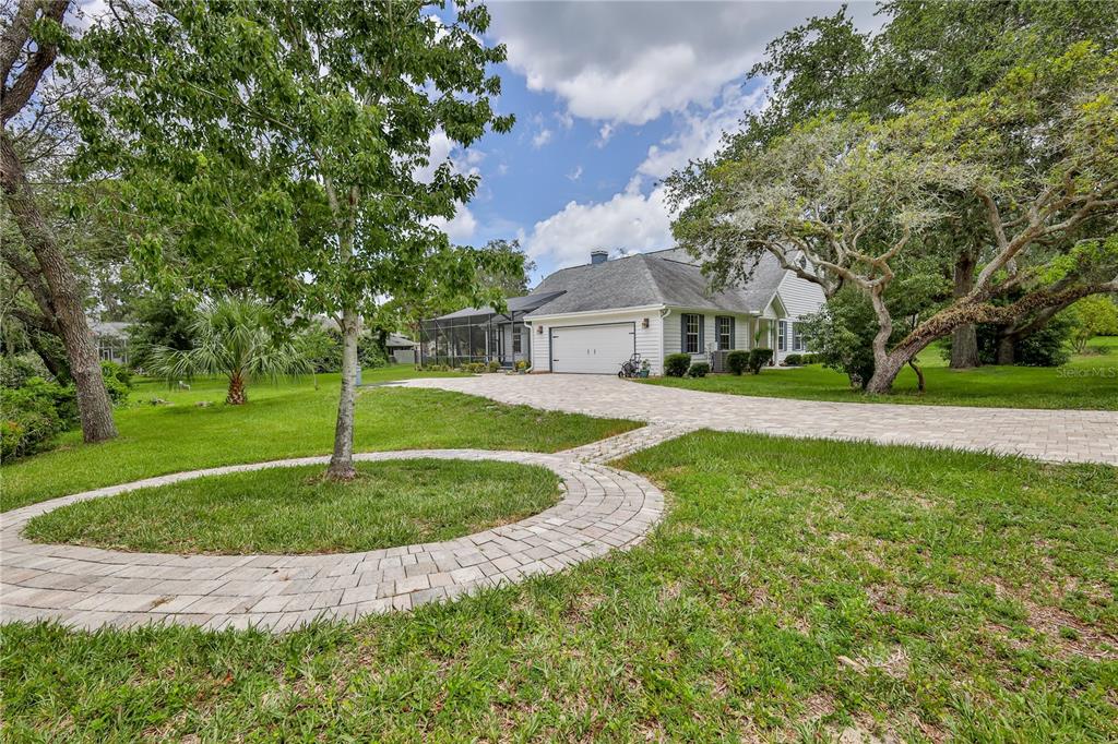 7512 Oak Tree Lane Spring Hill, FL 34607 - Photo 88 of 89 a view of a house with a backyard