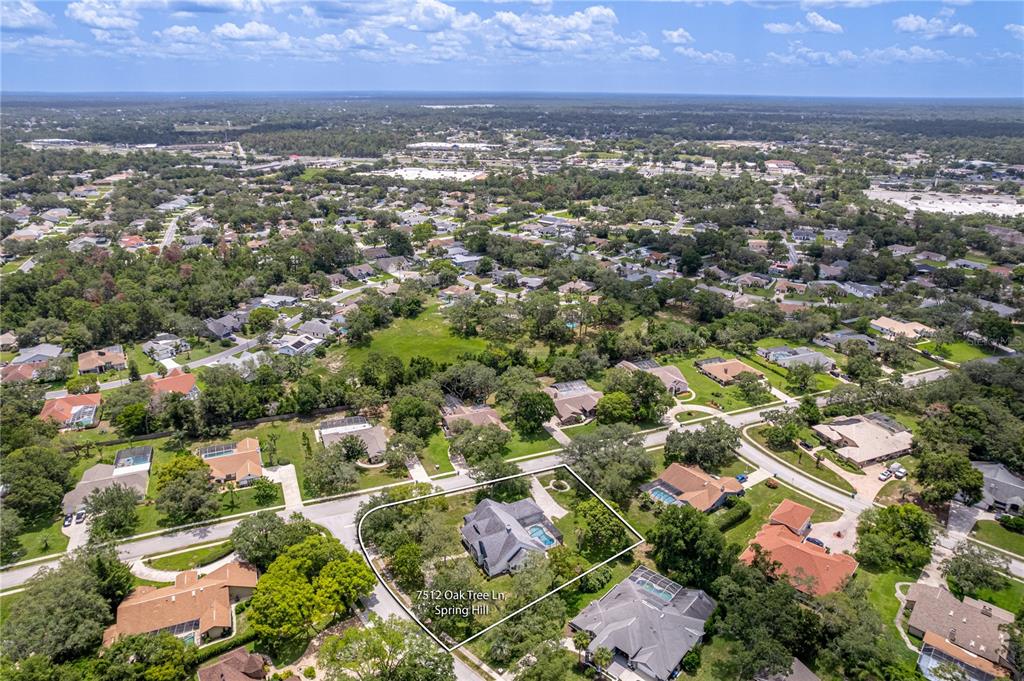 7512 Oak Tree Lane Spring Hill, FL 34607 - Photo 89 of 89 an aerial view of residential houses with outdoor space