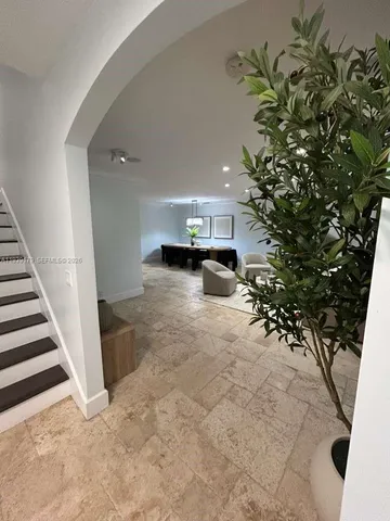 a view of a vase of flowers sitting on a table