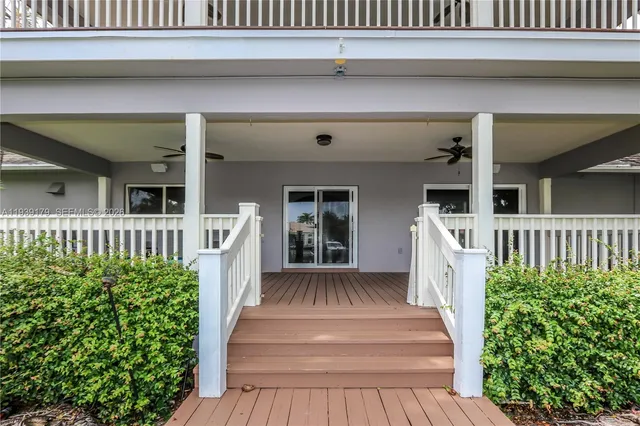 a view of a balcony with wooden floor