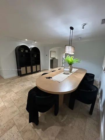 a room with hard wood floor and a flat screen tv