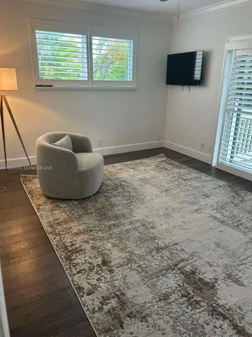 a spacious bedroom with a bed and window