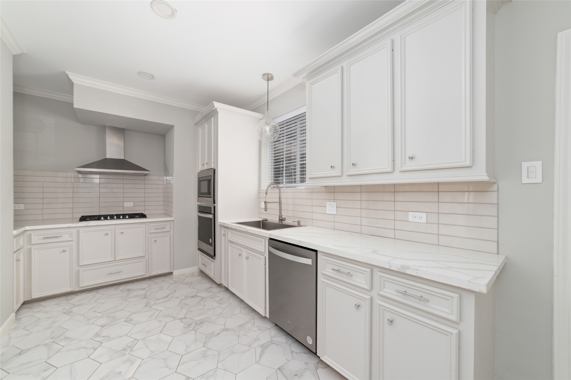 1516 Park Street, Unit B Houston, TX 77019 - Photo 1 of 20 a kitchen with white cabinets and white appliances