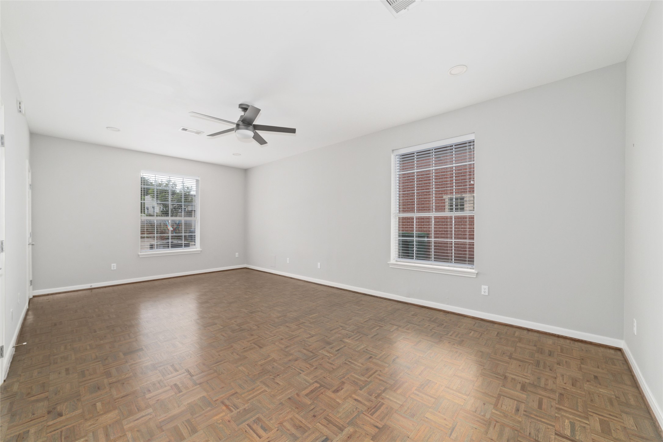 1516 Park Street, Unit B Houston, TX 77019 - Photo 10 of 20 an empty room with windows and ceiling fan