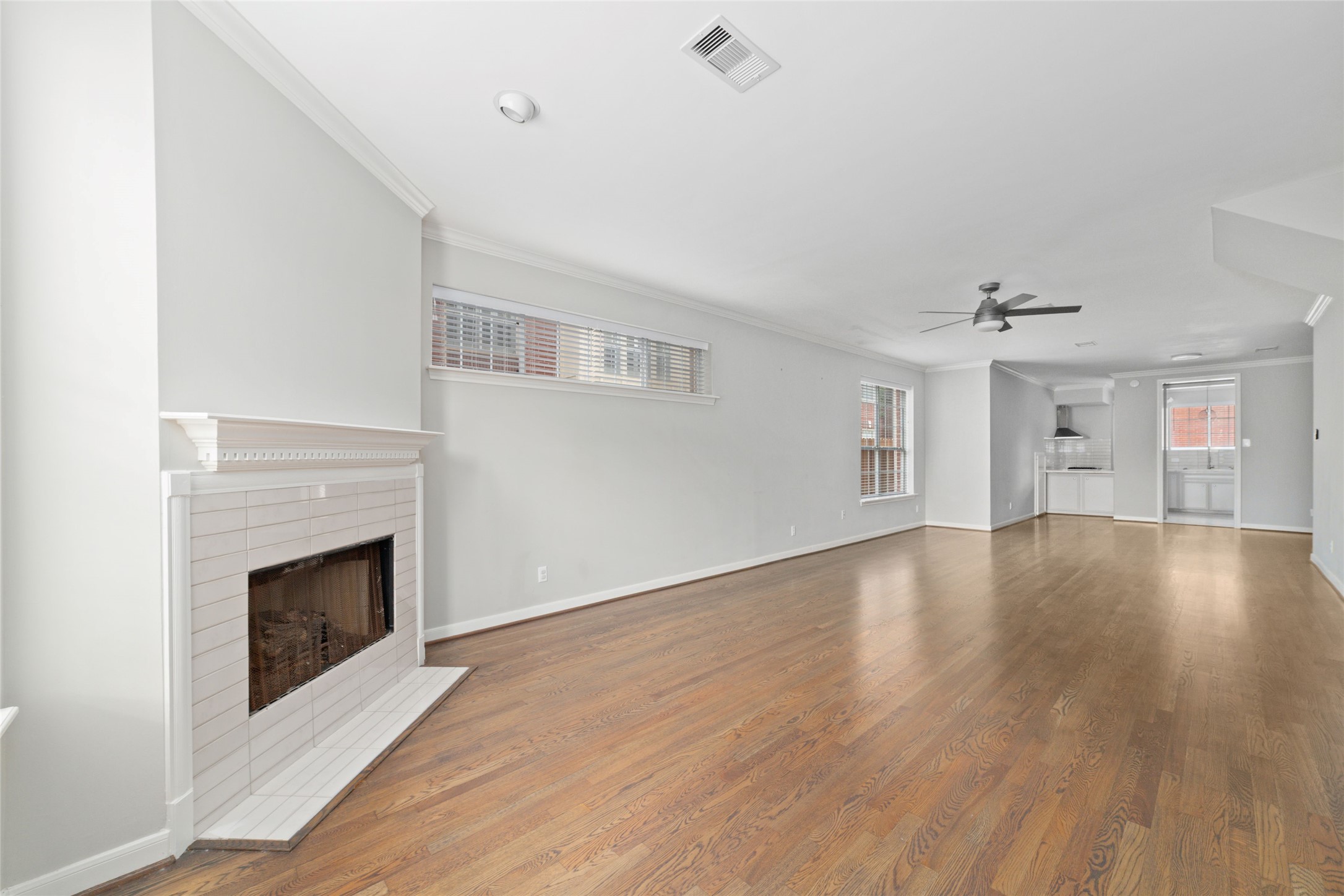 1516 Park Street, Unit B Houston, TX 77019 - Photo 20 of 20 a view of empty room with wooden floor and fireplace