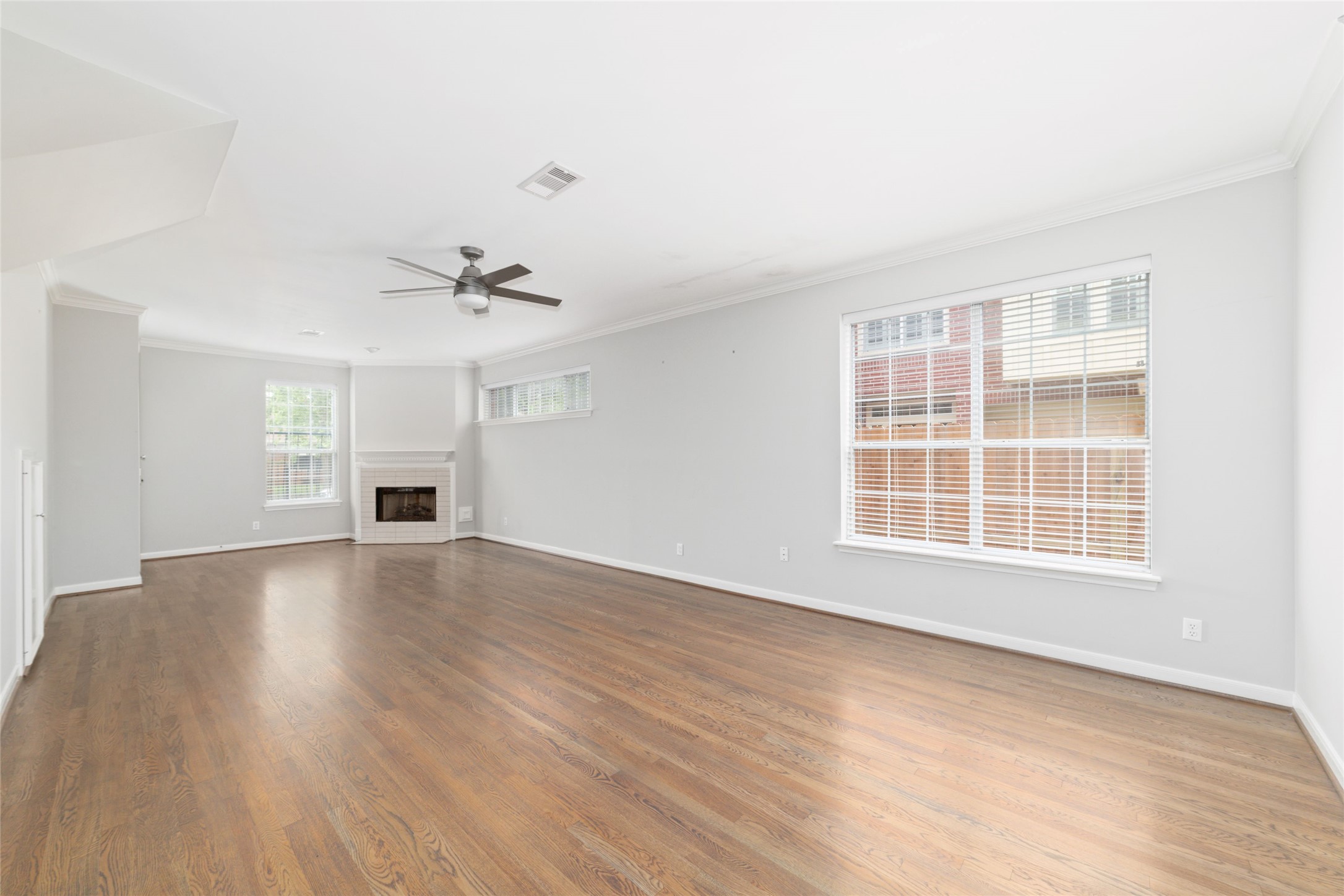 1516 Park Street, Unit B Houston, TX 77019 - Photo 5 of 20 wooden floor in an empty room with a window