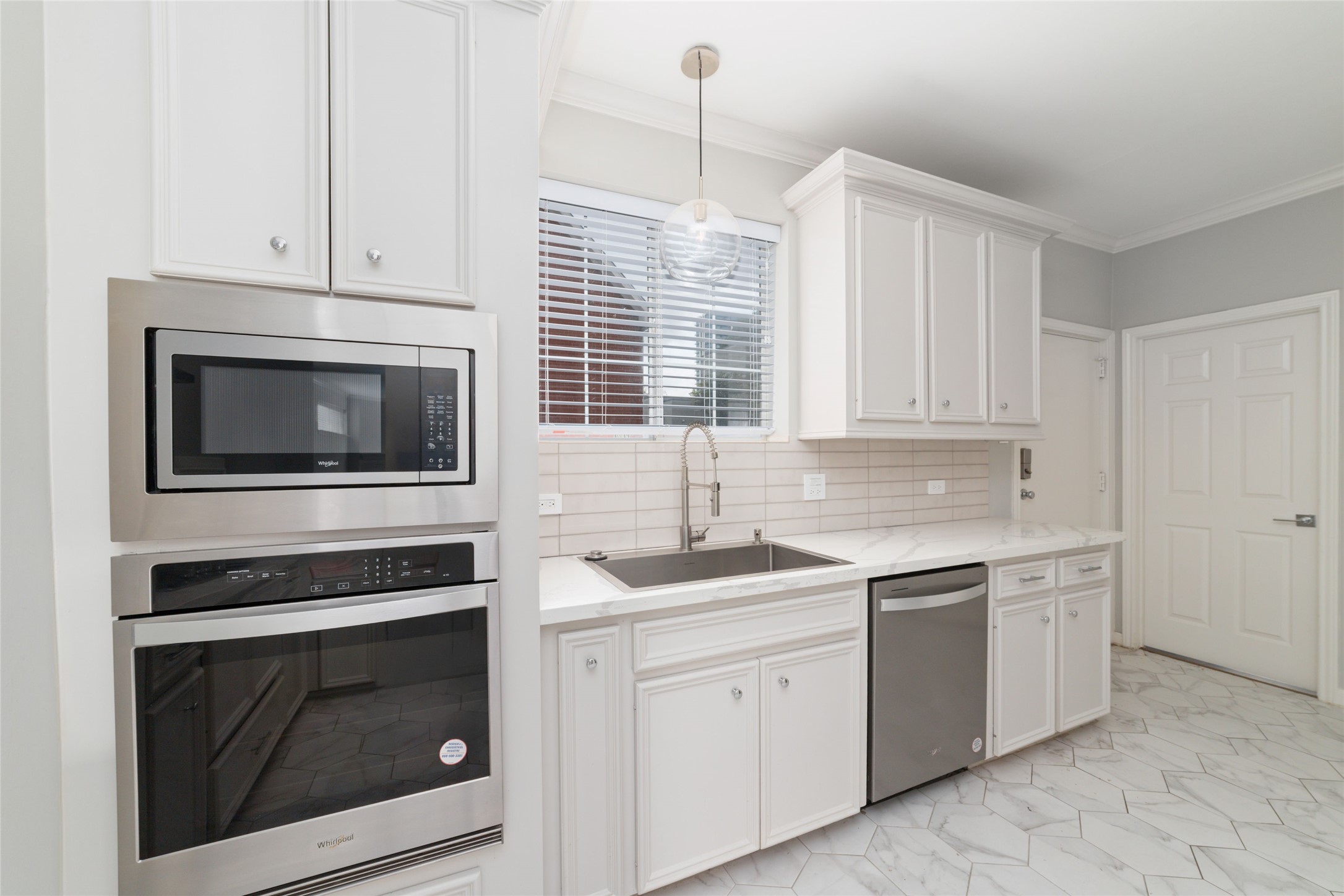 1516 Park Street, Unit B Houston, TX 77019 - Photo 7 of 20 a kitchen with white cabinets stainless steel appliances and sink