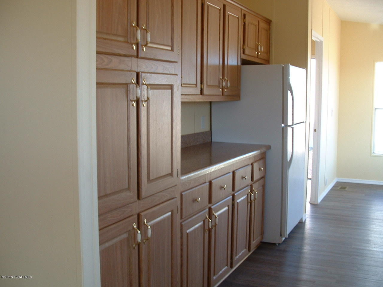 1725 West Big Sky Ranch Road Paulden, AZ 86334 - Photo 15 of 30 a kitchen with stainless steel appliances granite countertop a refrigerator and a sink