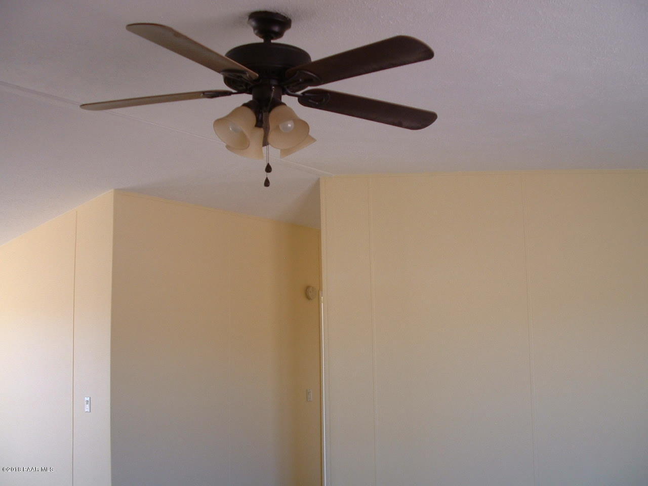1725 West Big Sky Ranch Road Paulden, AZ 86334 - Photo 17 of 30 a close view of a light fixture of a refrigerator