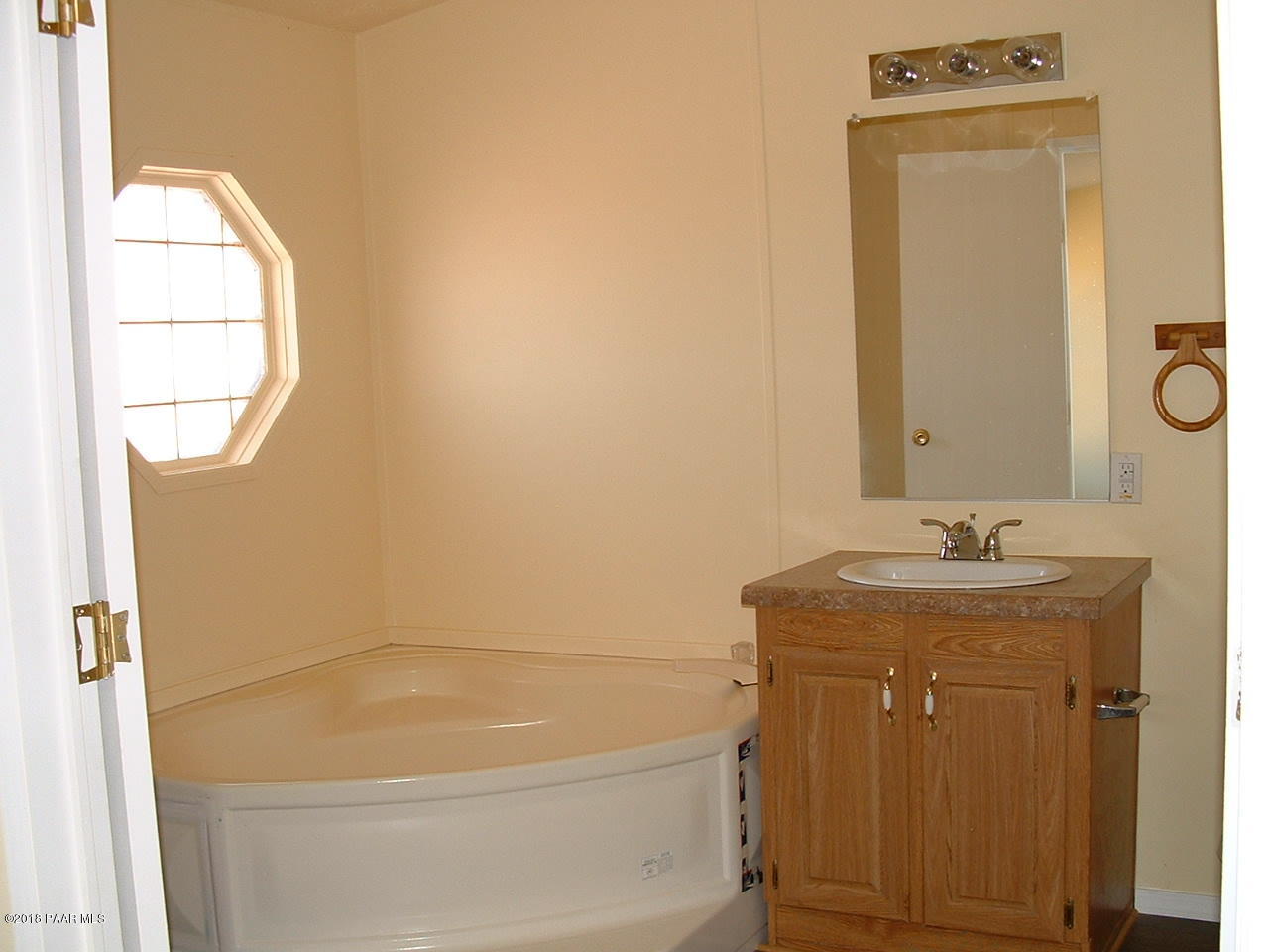 1725 West Big Sky Ranch Road Paulden, AZ 86334 - Photo 20 of 30 a bath room with a sink and a mirror