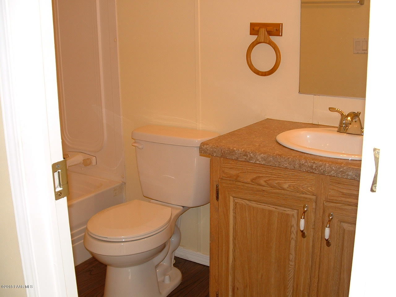 1725 West Big Sky Ranch Road Paulden, AZ 86334 - Photo 24 of 30 a bathroom with a granite countertop toilet sink and mirror