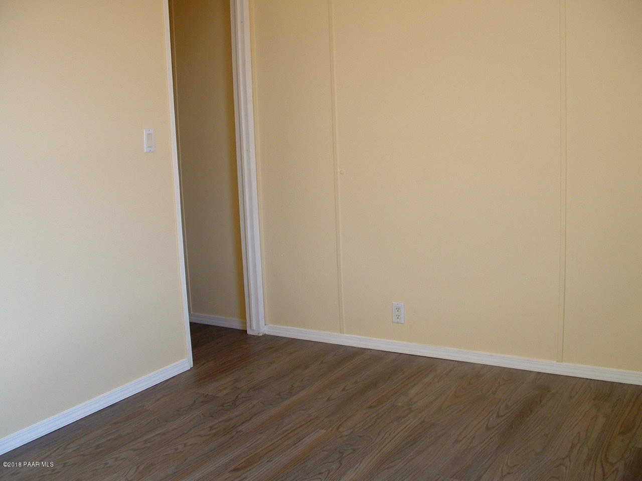 1725 West Big Sky Ranch Road Paulden, AZ 86334 - Photo 25 of 30 an empty room with wooden floor