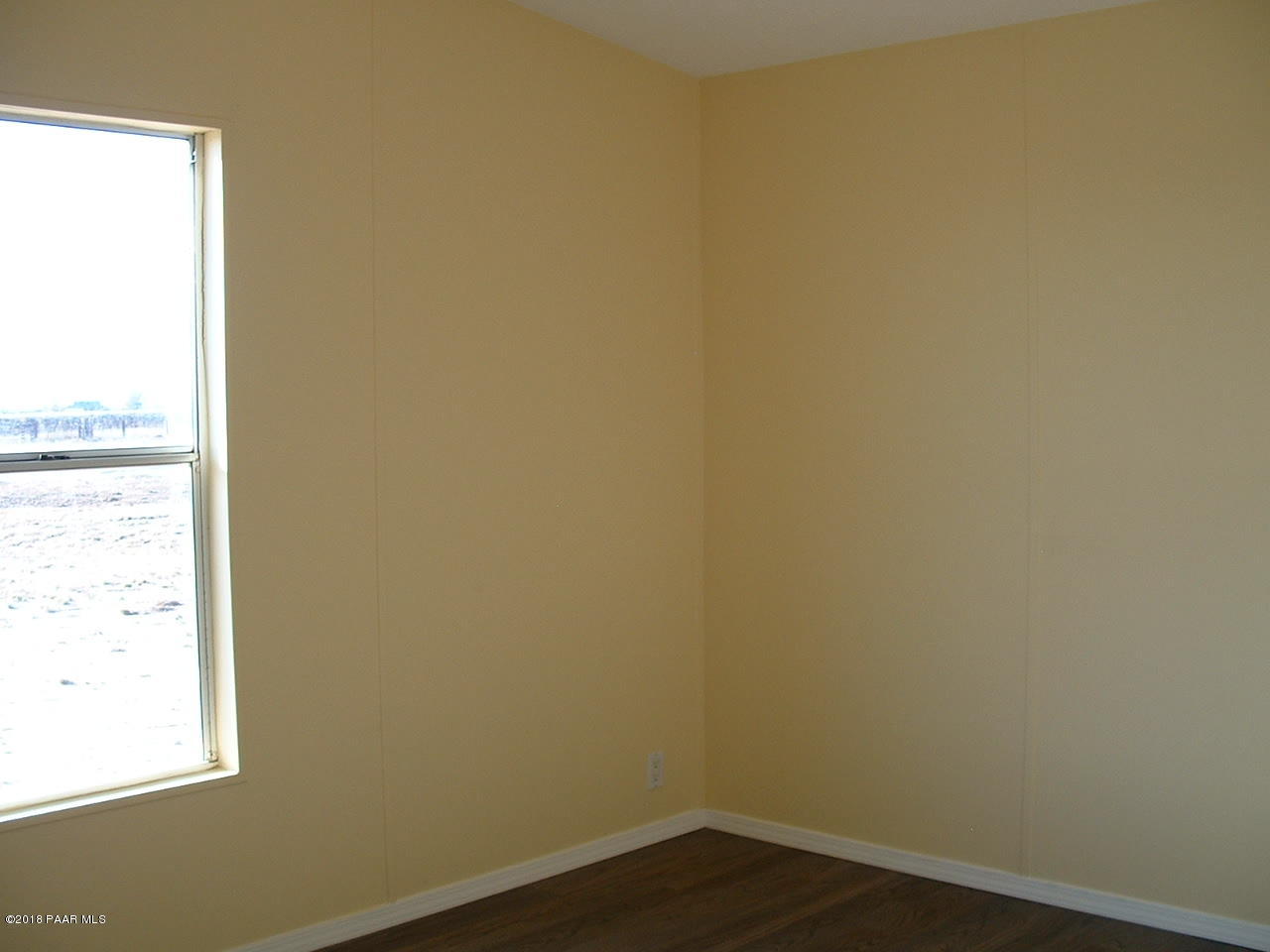 1725 West Big Sky Ranch Road Paulden, AZ 86334 - Photo 26 of 30 a view of a small space with wooden floor and a window
