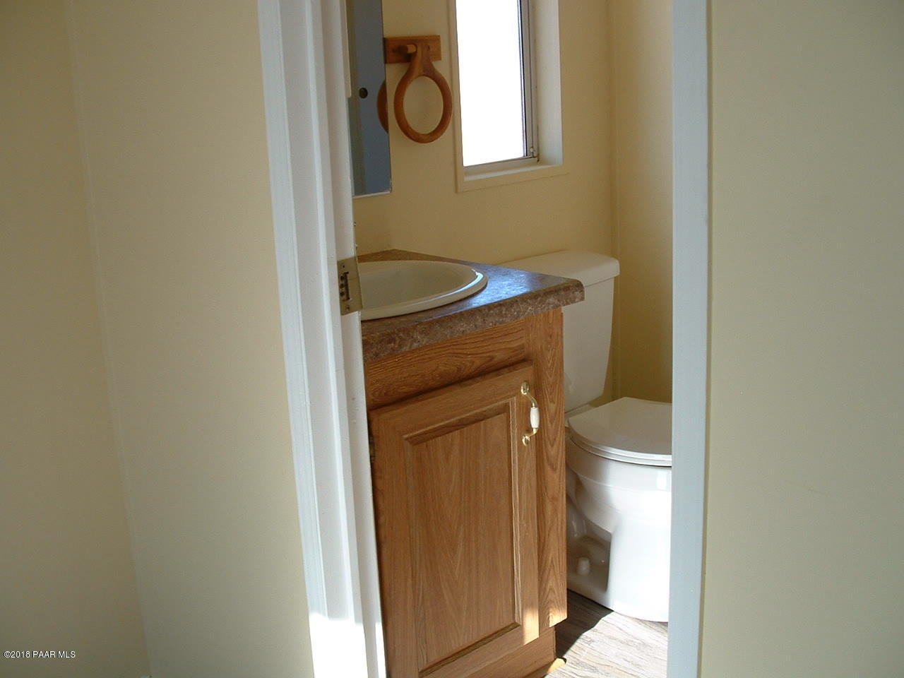 1725 West Big Sky Ranch Road Paulden, AZ 86334 - Photo 27 of 30 a bathroom with a toilet and a sink