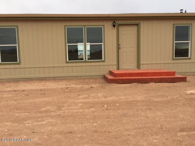 1725 West Big Sky Ranch Road Paulden, AZ 86334 - Photo 3 of 30 a front view of a house