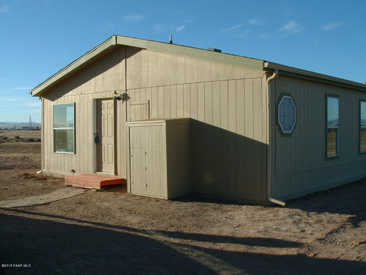 1725 West Big Sky Ranch Road Paulden, AZ 86334 - Photo 6 of 30 a house with trees in the background