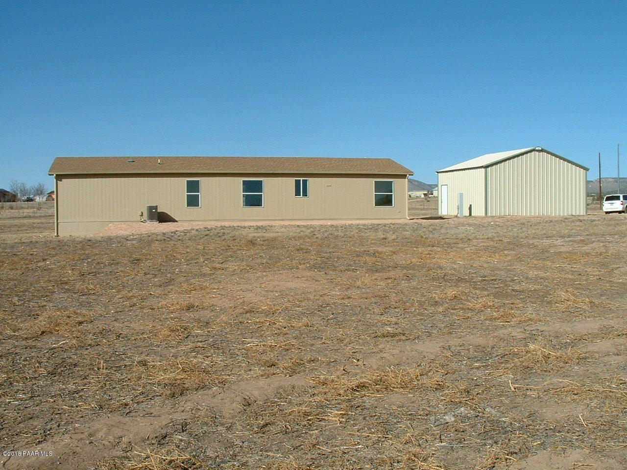 1725 West Big Sky Ranch Road Paulden, AZ 86334 - Photo 9 of 30 a front view of a house with yard