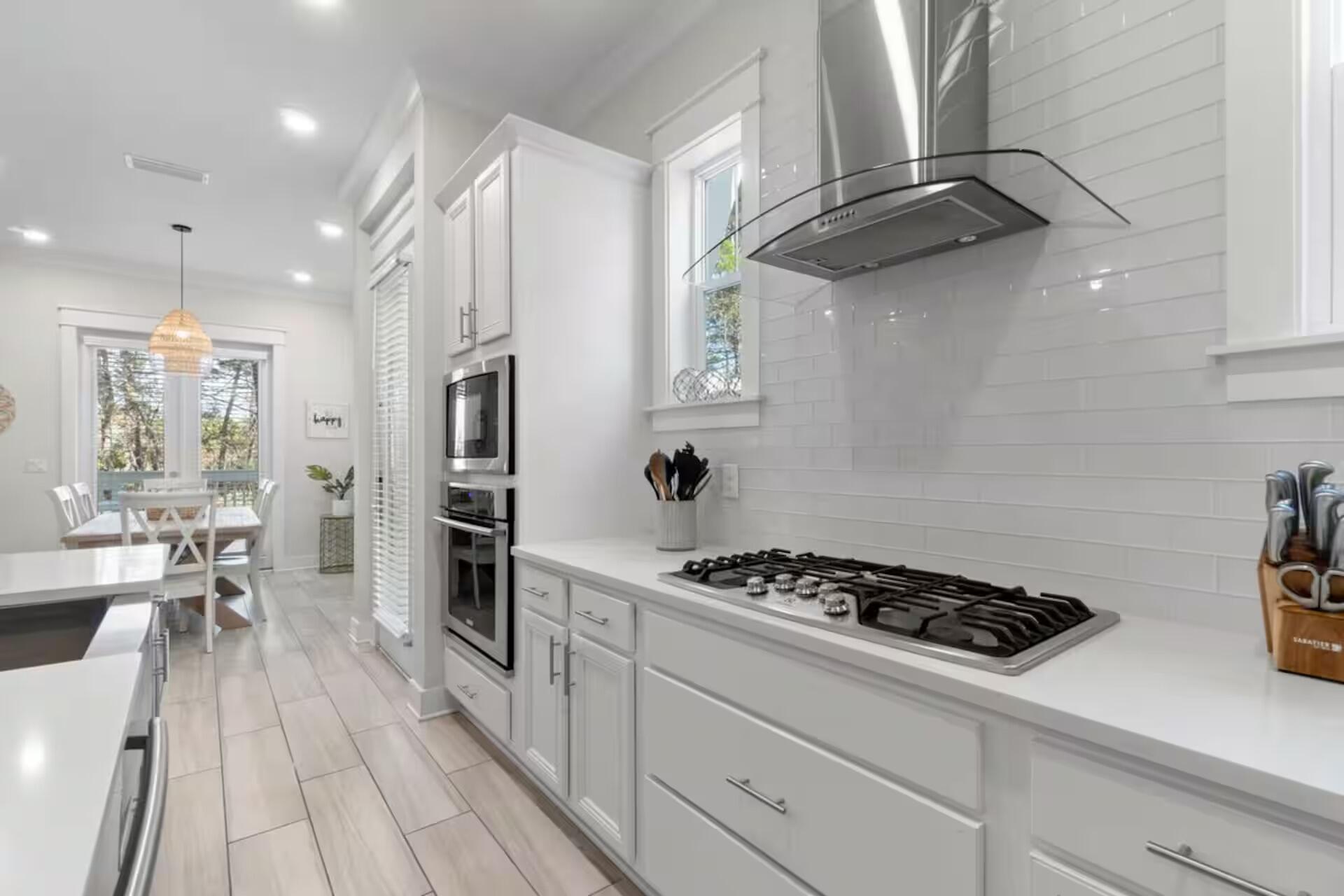 146 East E Pine, Unit B Inlet Beach, FL 32461 - Photo 13 of 47 a kitchen with stainless steel appliances granite countertop a stove and a refrigerator