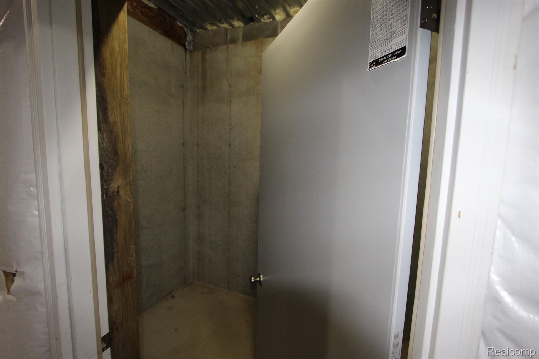 2975 East Coon Lake Road Howell, MI 48843 - Photo 81 of 175 ROOM IN BASEMENT UNDER FRONT PORCH CELLAR ROOM