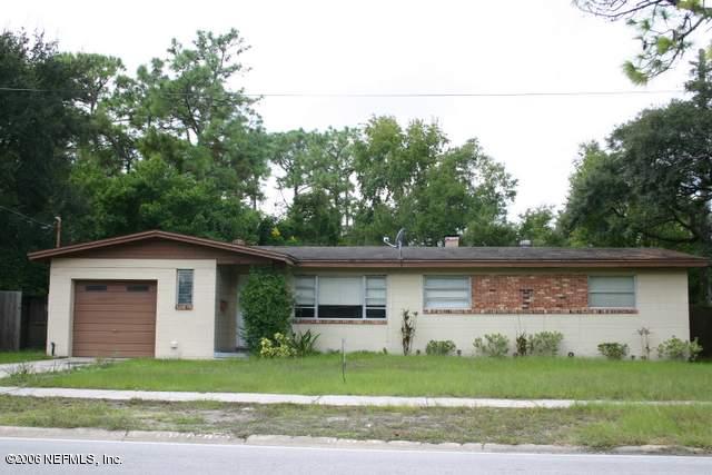 3614 Rogero Road Jacksonville, FL 32277 - Photo 1 of 1 a front view of a house with a garden