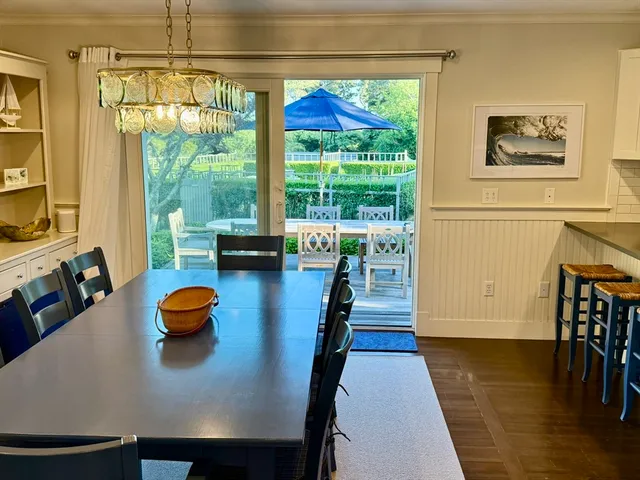 a view of a dining room with furniture and window