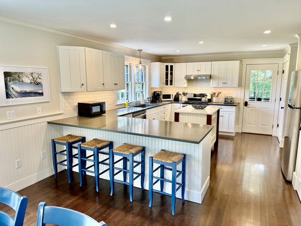 1 A Pochick Avenue Nantucket, MA 02554 - Photo 19 of 41 a view of a dining room with furniture and wooden floor