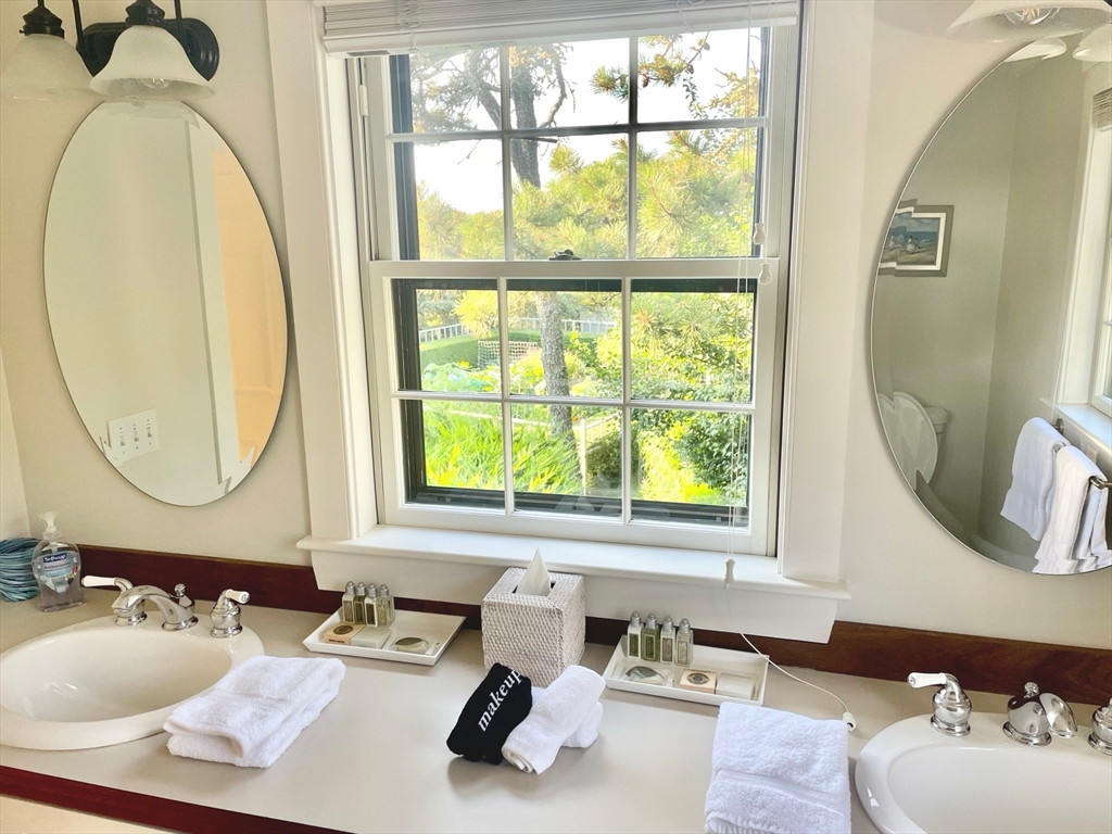 1 A Pochick Avenue Nantucket, MA 02554 - Photo 29 of 41 a bathroom with a sink and a mirror