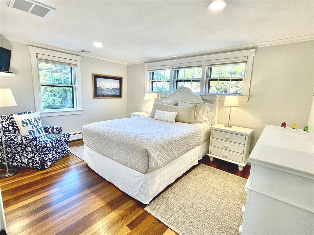 1 A Pochick Avenue Nantucket, MA 02554 - Photo 30 of 41 a bedroom with a large bed and a couch