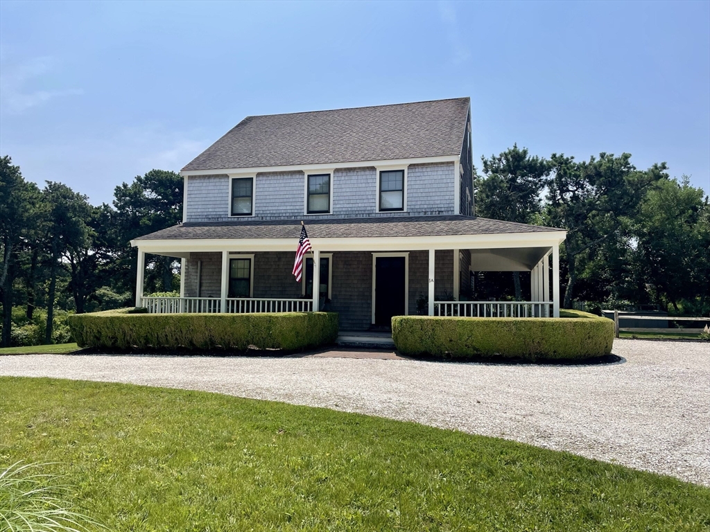 1 A Pochick Avenue Nantucket, MA 02554 - Photo 3 of 41 a front view of a house with a garden