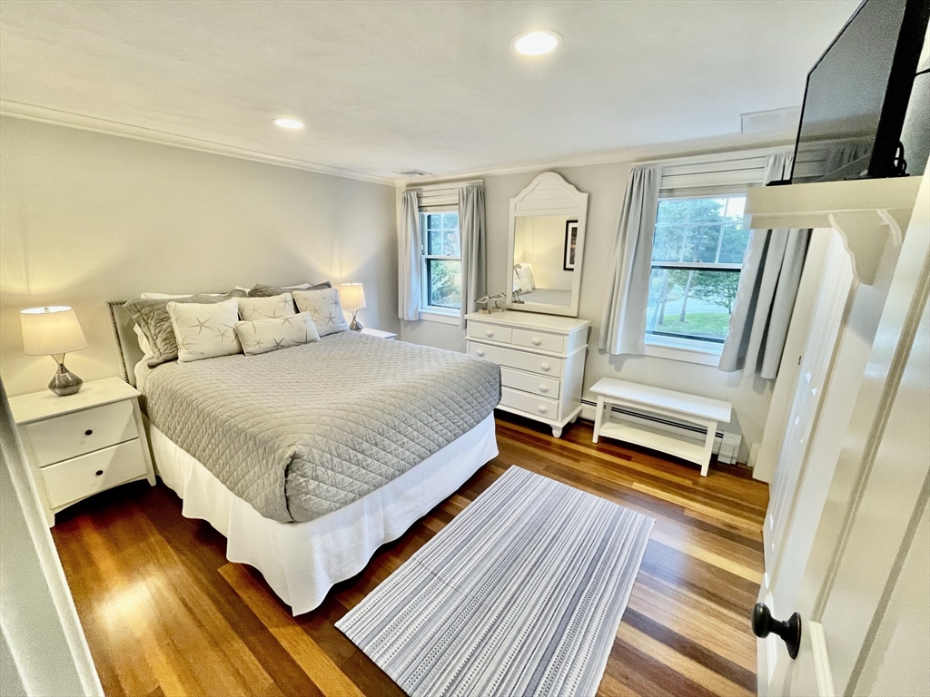 1 A Pochick Avenue Nantucket, MA 02554 - Photo 31 of 41 a bedroom with a bed and wooden floor