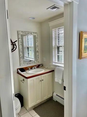 a bedroom with a bed and a table