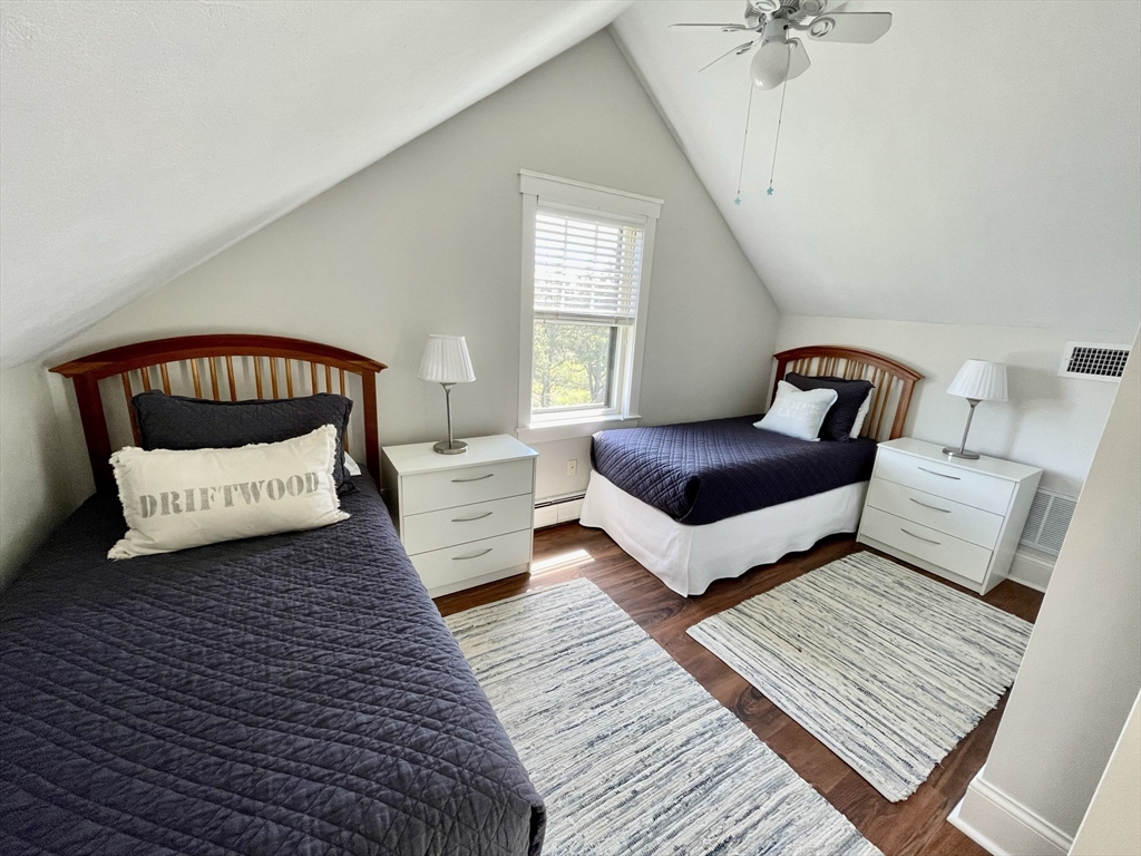 1 A Pochick Avenue Nantucket, MA 02554 - Photo 33 of 41 a bedroom with a bed couch and window