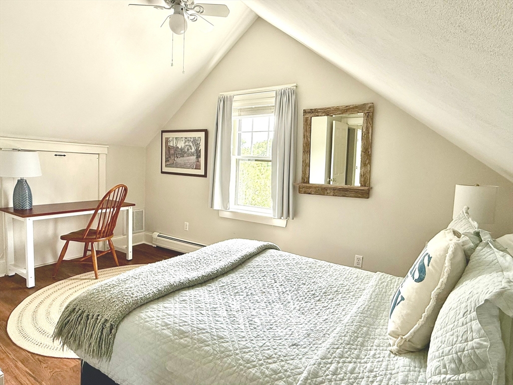 1 A Pochick Avenue Nantucket, MA 02554 - Photo 34 of 41 a bedroom with a bed and a table