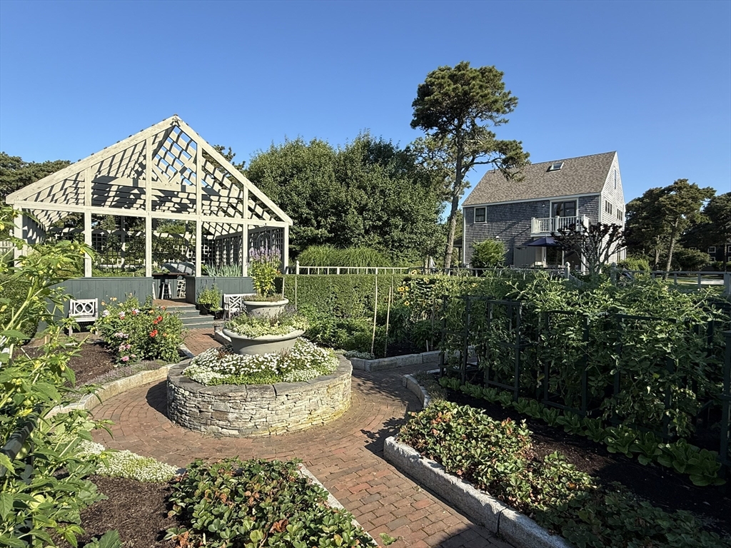 1 A Pochick Avenue Nantucket, MA 02554 - Photo 37 of 41 a view of a house with fountain in a yard