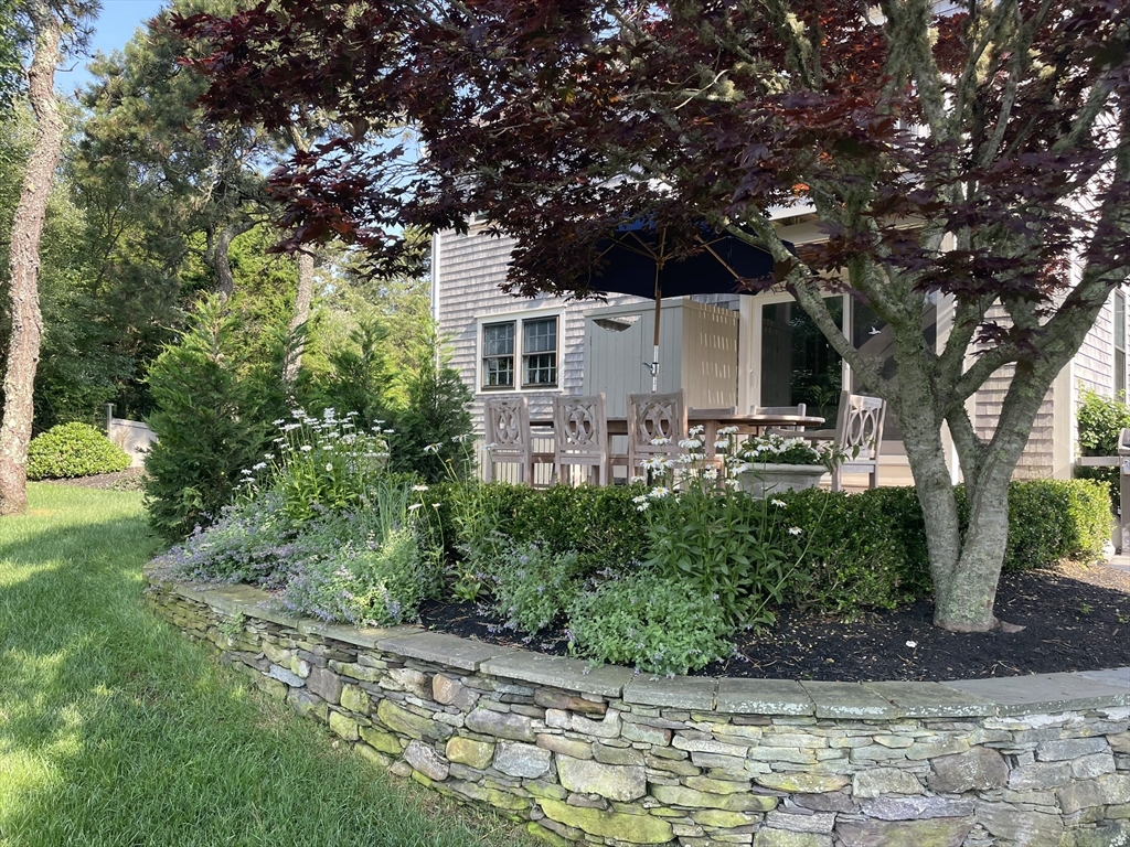 1 A Pochick Avenue Nantucket, MA 02554 - Photo 9 of 41 a front view of a house with garden