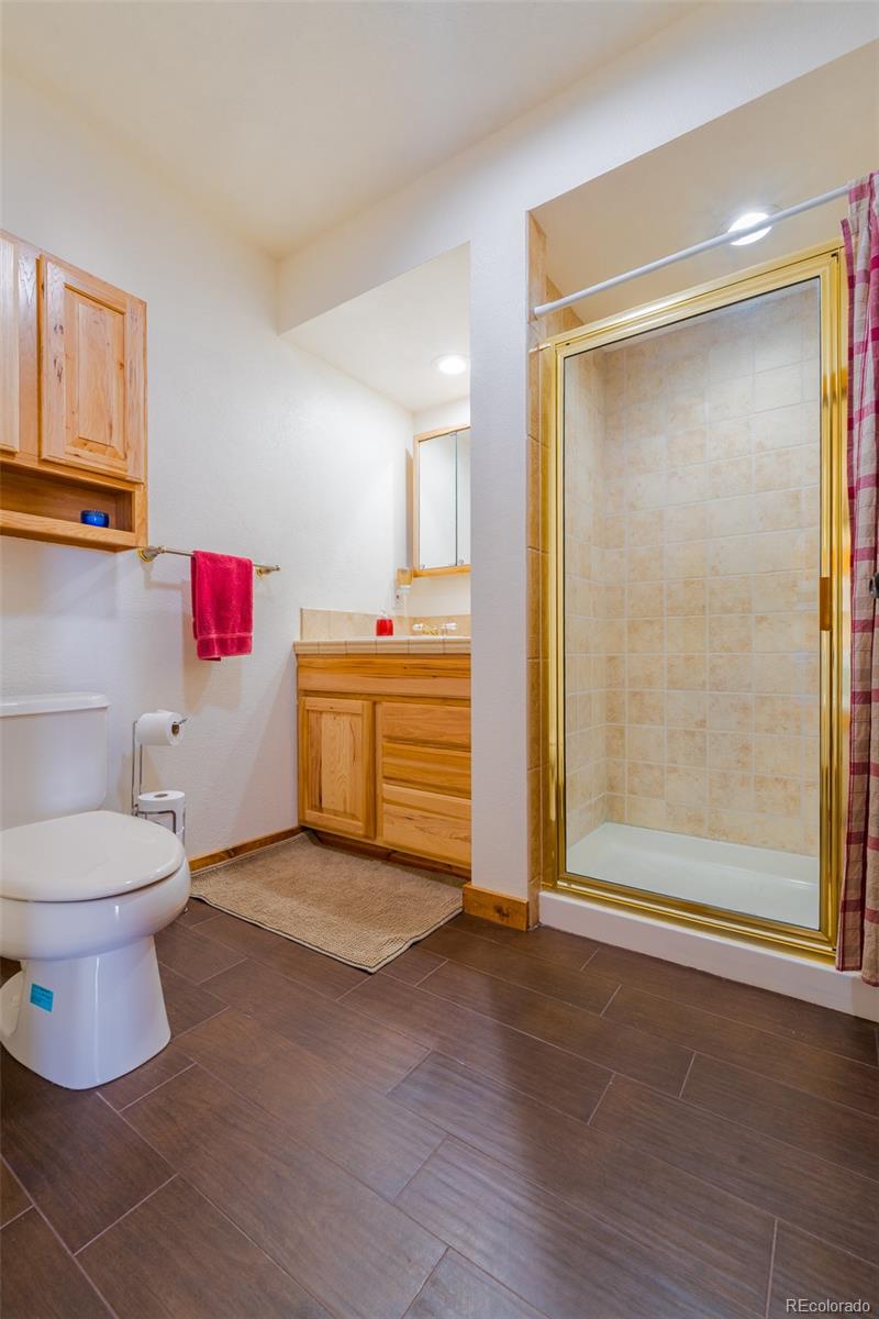8221 Remington Road Como, CO 80432 - Photo 21 of 49 a bathroom with a toilet and a shower
