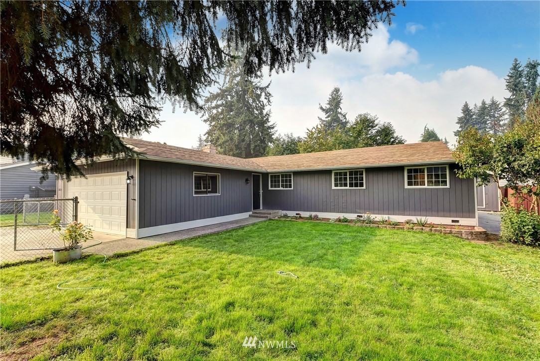 2623 171st Street Southeast Bothell, WA 98012 - Photo 1 of 26 a view of a yard in front of a house with large tree