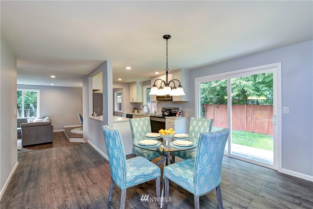 2623 171st Street Southeast Bothell, WA 98012 - Photo 12 of 26 a dining room with furniture window wooden floor