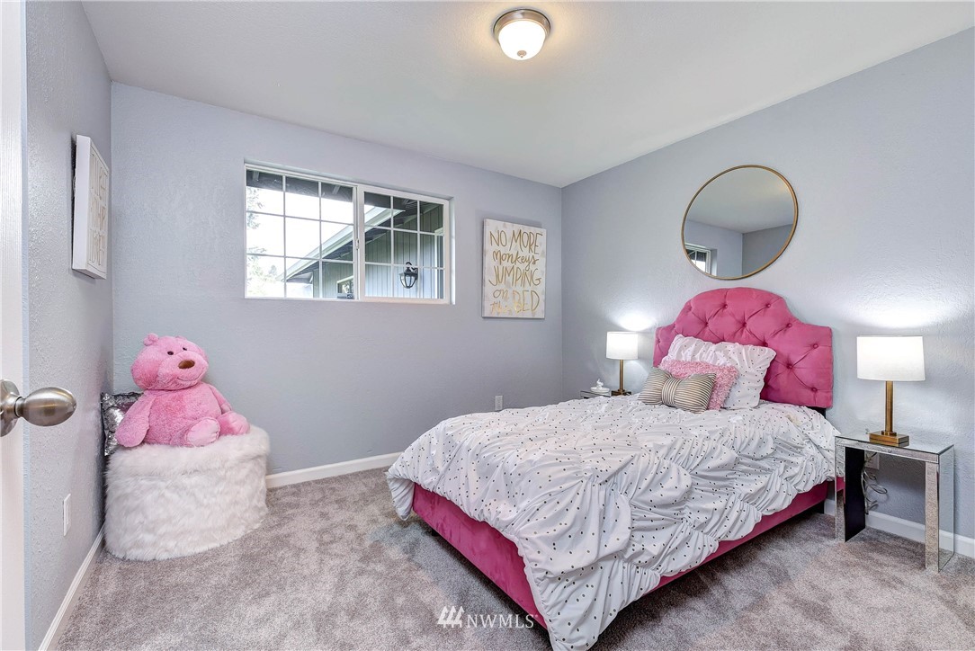 2623 171st Street Southeast Bothell, WA 98012 - Photo 14 of 26 a bedroom with a bed and a window