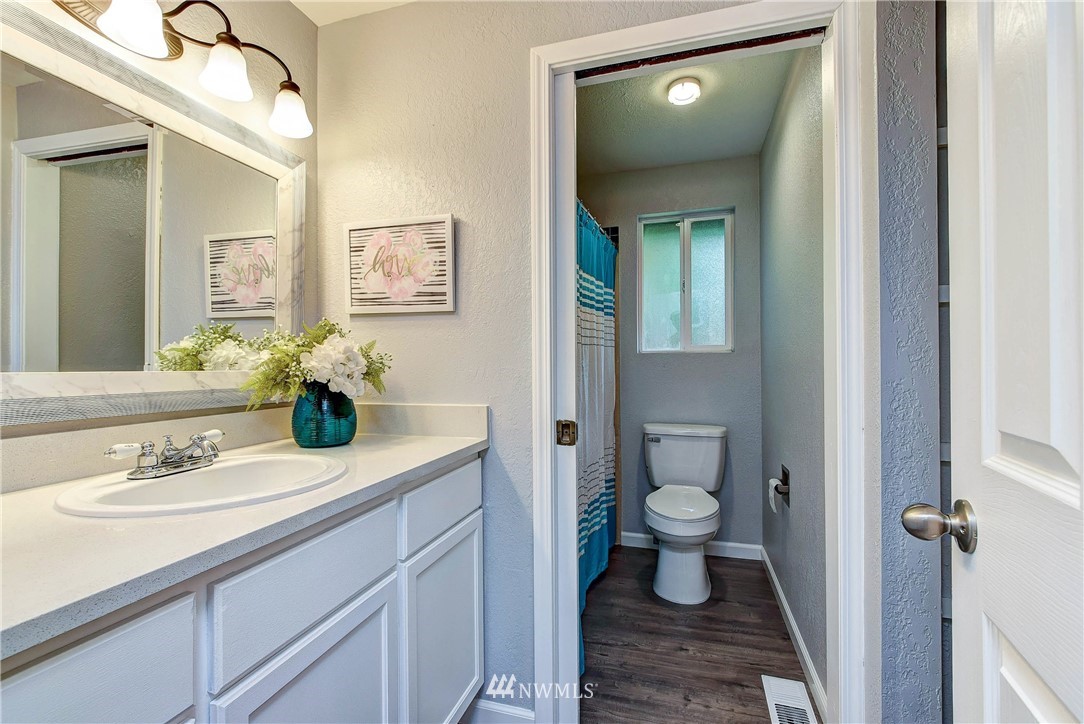 2623 171st Street Southeast Bothell, WA 98012 - Photo 15 of 26 a bathroom with a sink and a mirror