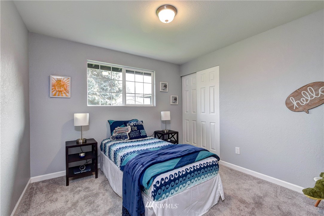 2623 171st Street Southeast Bothell, WA 98012 - Photo 16 of 26 a bedroom with a bed and a window