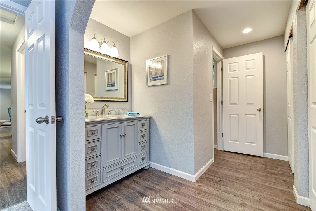 2623 171st Street Southeast Bothell, WA 98012 - Photo 18 of 26 a bathroom with a granite countertop sink mirror and