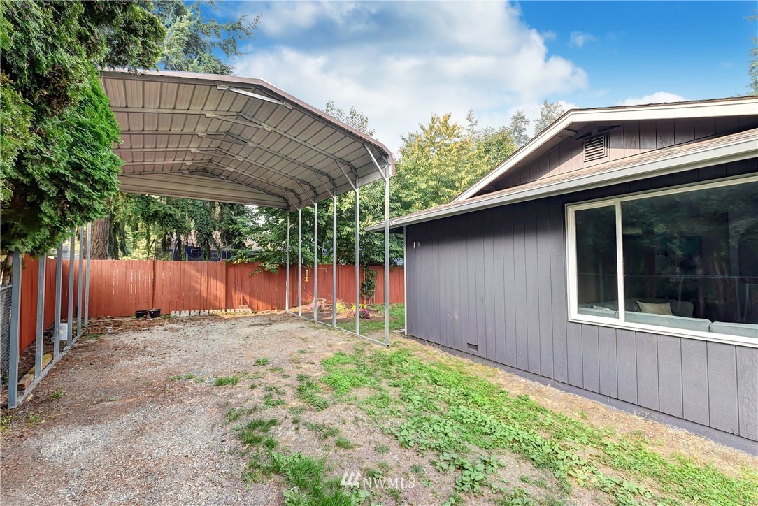 2623 171st Street Southeast Bothell, WA 98012 - Photo 24 of 26 a backyard of a house with plants and wooden fence